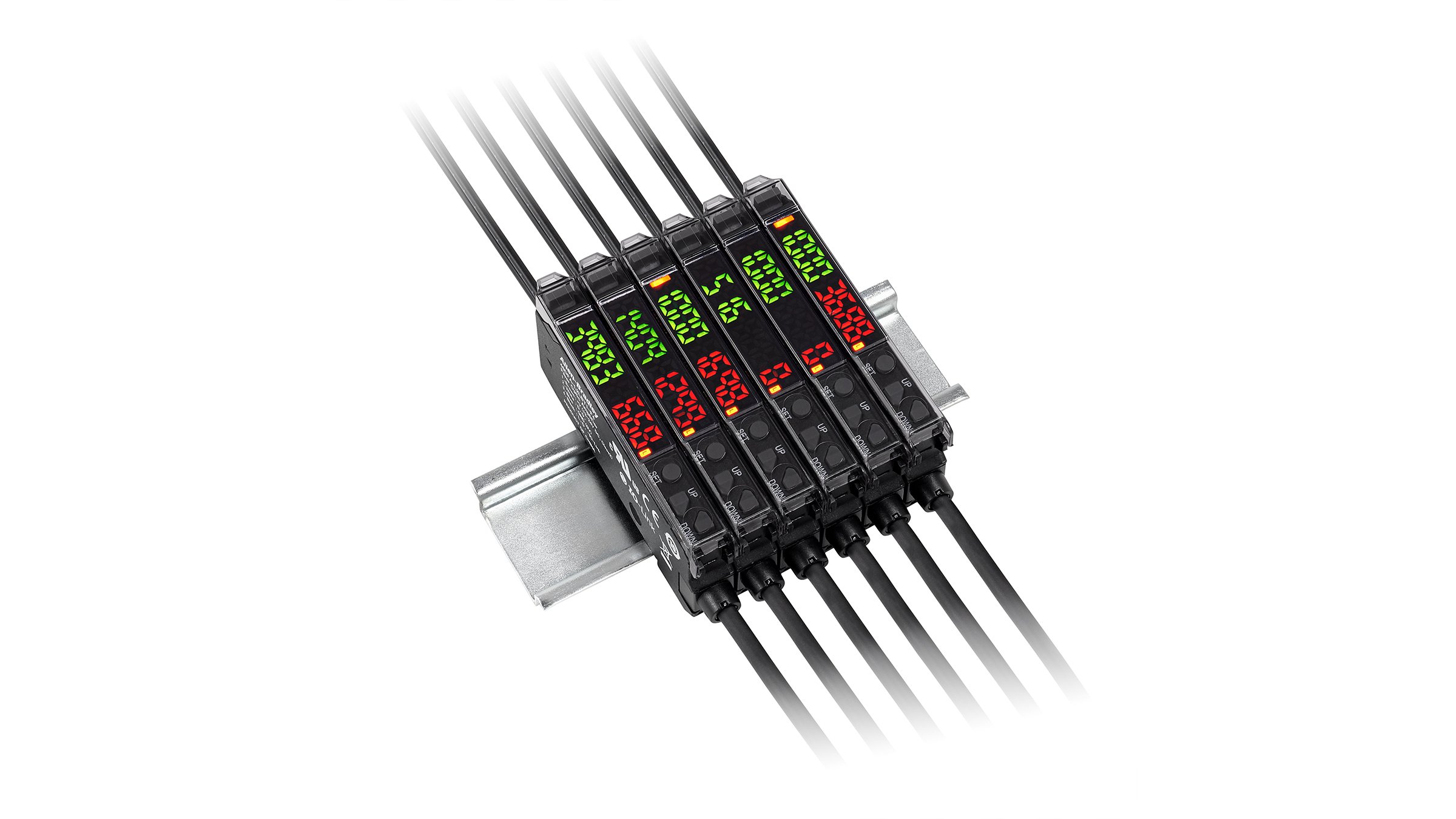 Six Allen-Bradley adjacent thin black, rectangular sensors with flush green and red indicators, cables on each end, mounted on a DIN rail.