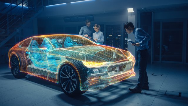 Grupo de engenheiros projetistas trabalhando em um protótipo de modelo 3D de realidade virtual de um chassi de carro elétrico