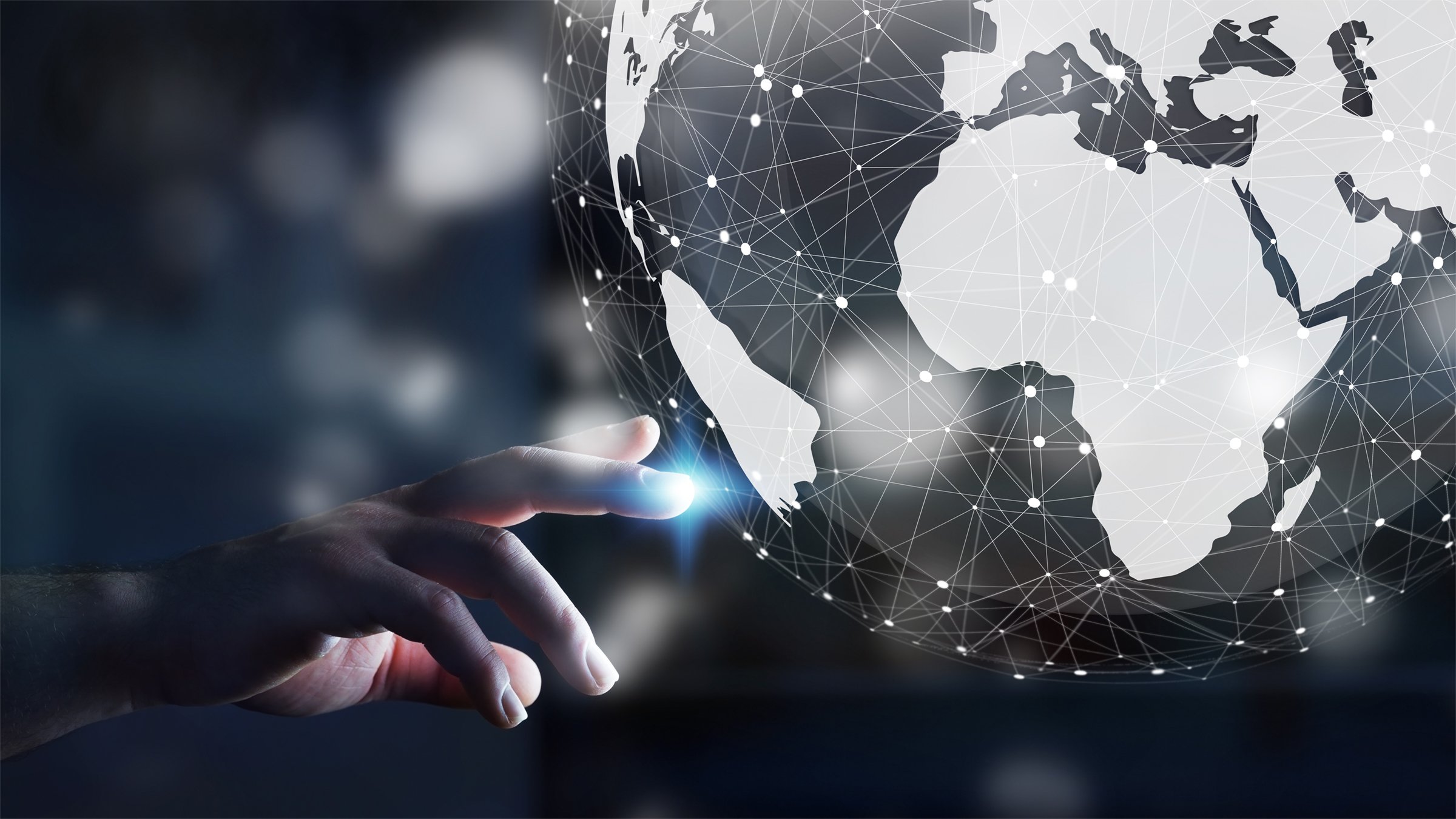 Businessman using digital tactile world interface with his finger