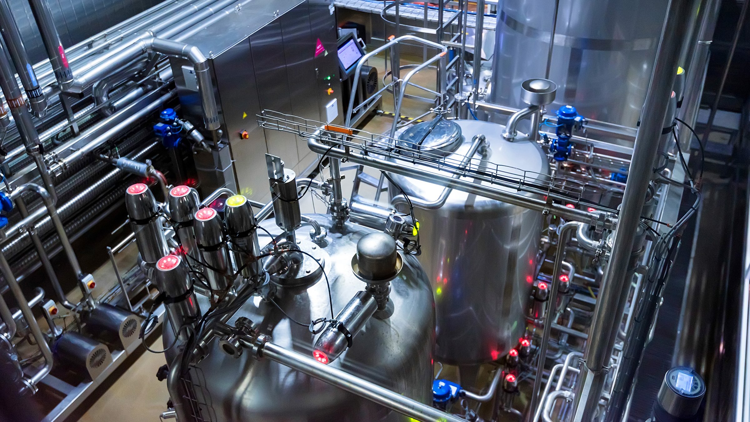 Metal reservoirs at a beverage manufacturing facility