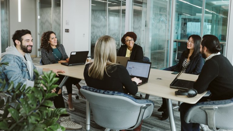 Group of coworkers meeting at a table