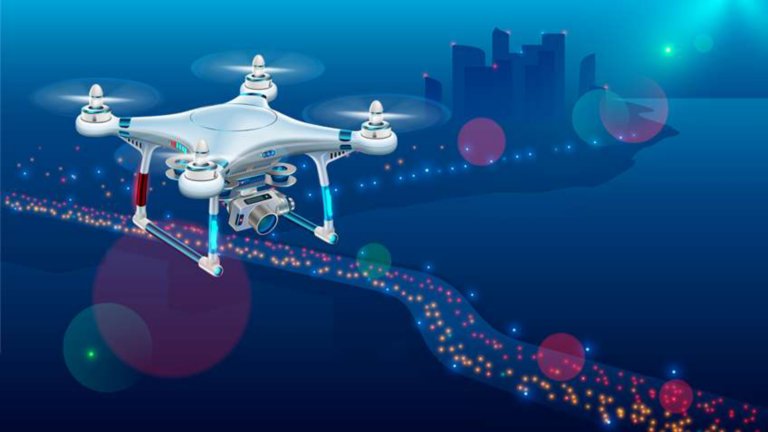 Drone with video camera In The Air Over City Roadway. Unmanned Aircraft System or UAV monitoring street traffic or photography urban landscape in the Night .