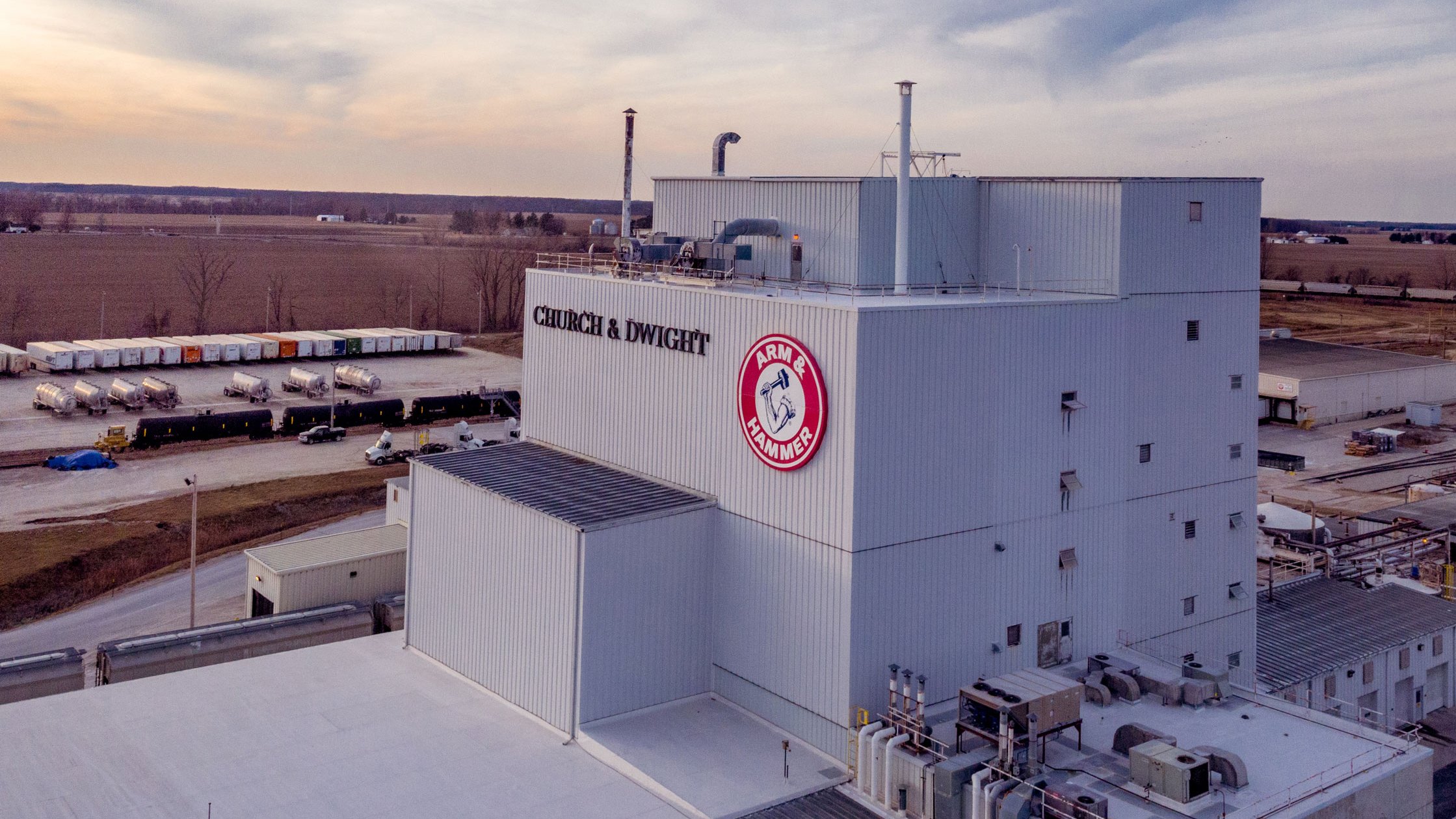 Manufacturing facility with Church & Dwight sign and Arm & Hammer logo. 
